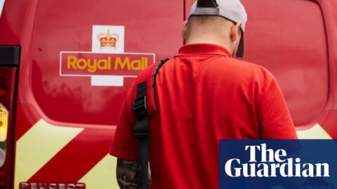 A Royal Mail worker with a bag, standing behind a Royal Mail van